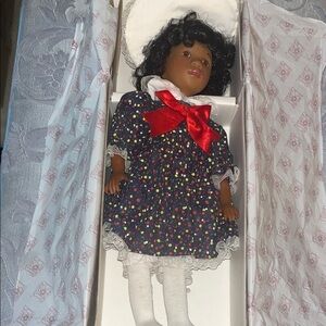Charming Doll with Red Bow and Polka Dot Dress
